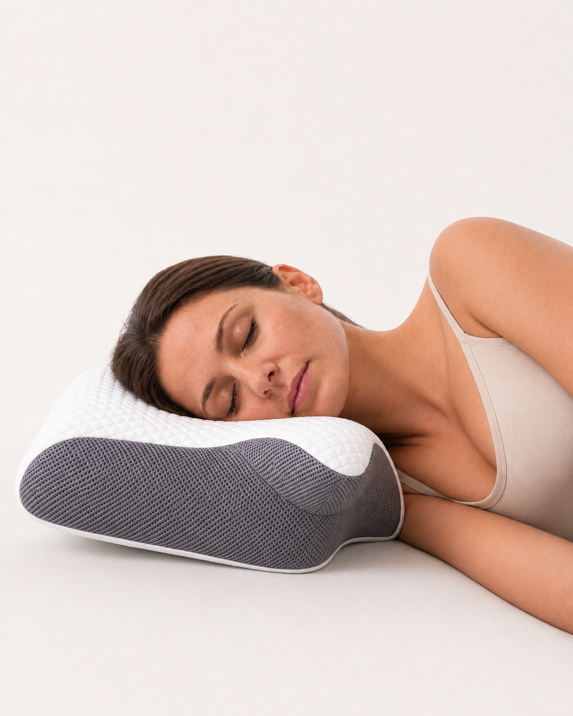 Woman sleeping peacefully on the Aurelia Cloud Pillow